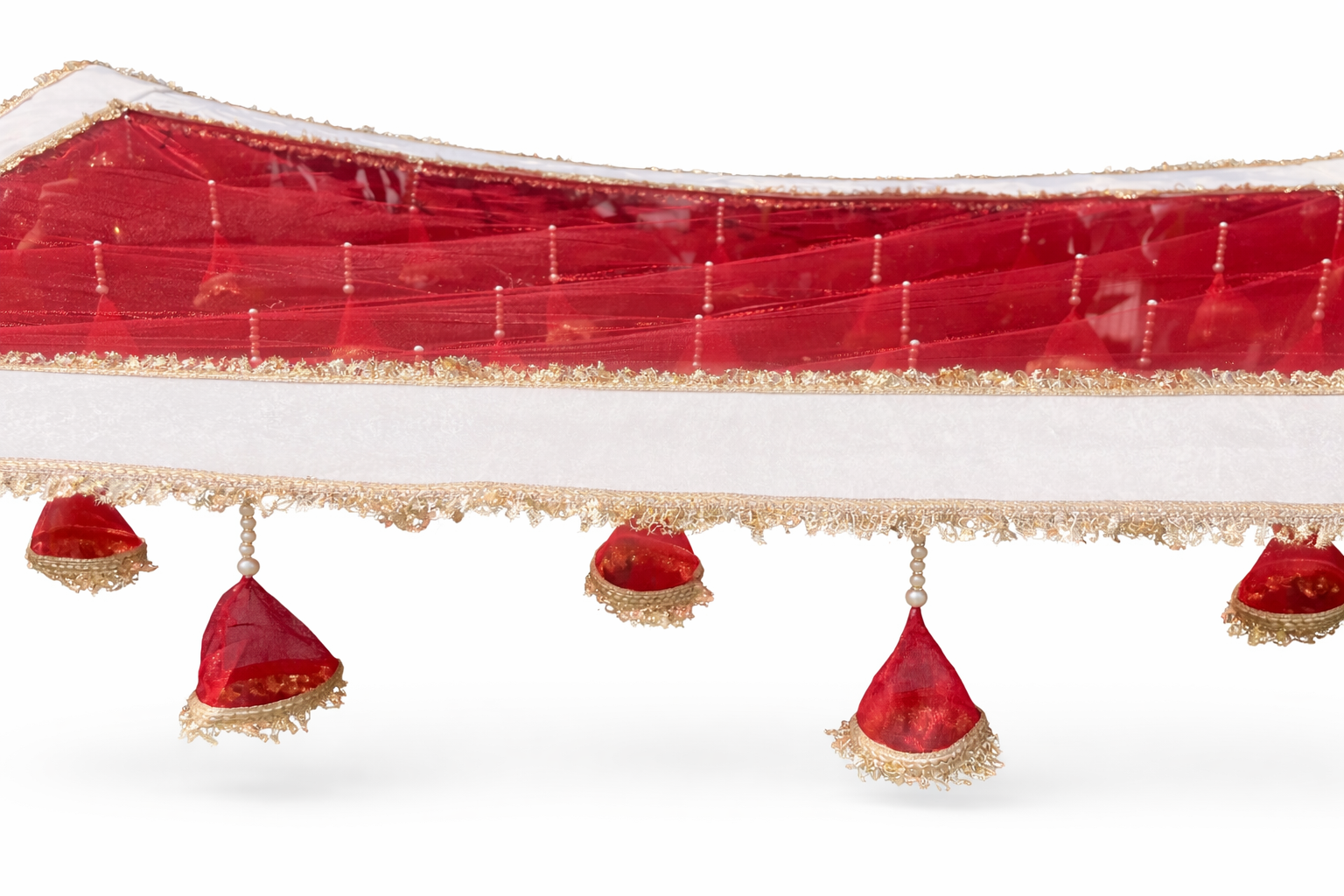 Decorative red fabric with gold trim and red triangular decorations on a white background