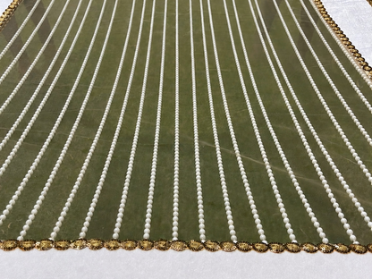 Green fabric with white vertical stripes and gold border on a white background